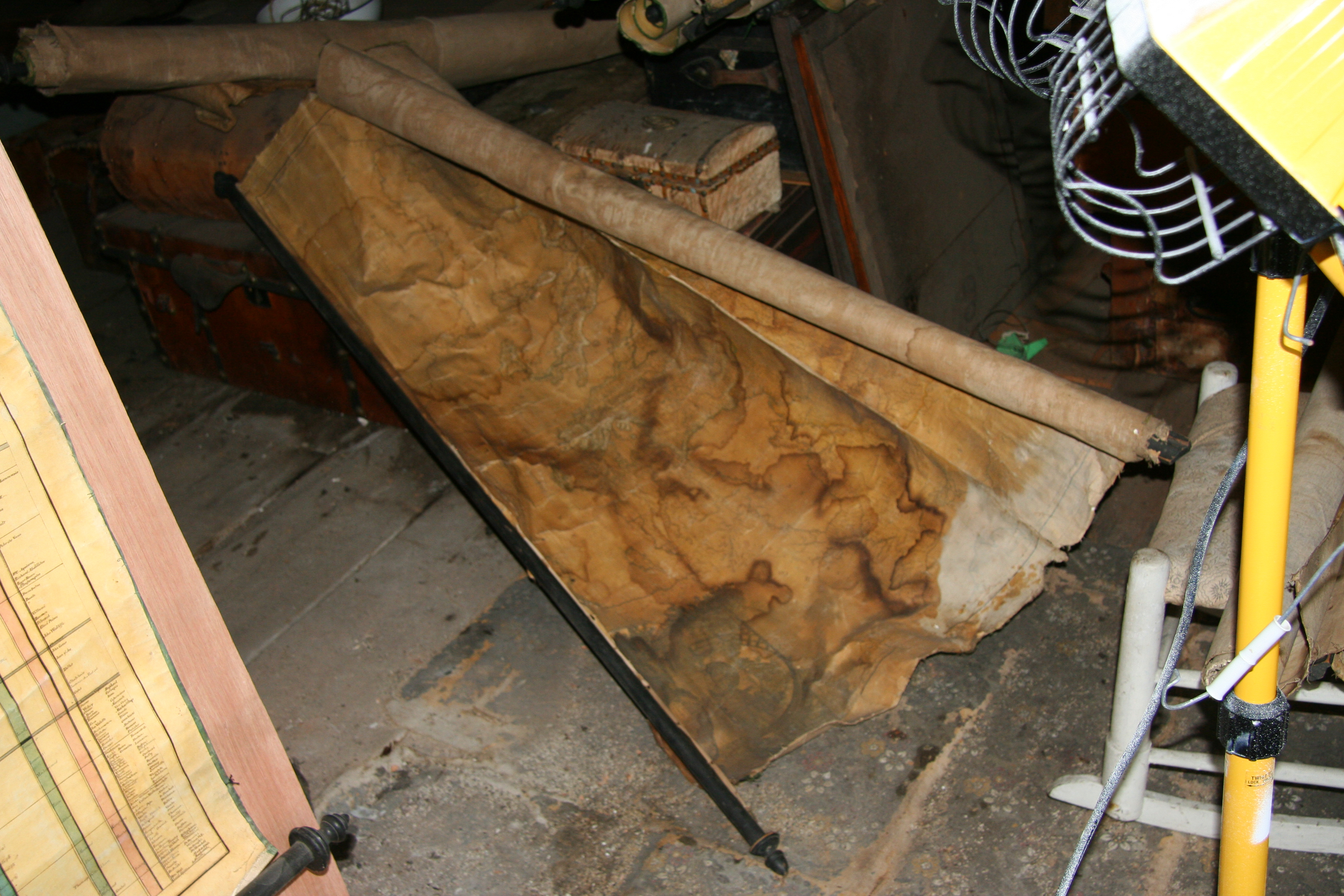 OLD USE UPDATED BELOW: An elaborate timeline printed on a scroll, which hangs open against a door. The timeline is composed of bars that stretch varying lengths down the chart, and each strip corresponds to different ancient civilizations, each shaded gray and stretched length- and widthwise to varying degrees.